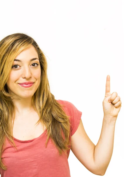 Portrait of a beautiful woman pointing up with her finger — Stock Photo, Image