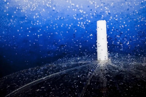 Raindrops falling on an umbrella — Stock Photo, Image