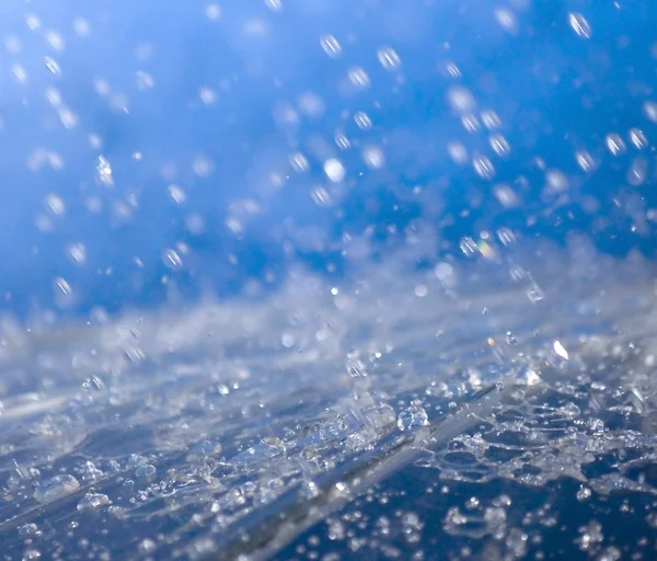 Raindrops falling on an umbrella — Stock Photo, Image