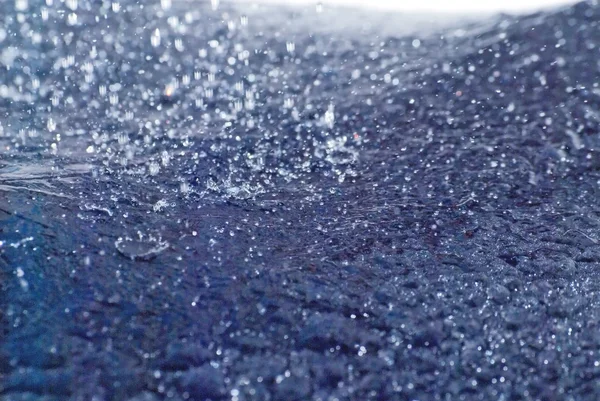 Raindrops falling on an umbrella — Stock Photo, Image