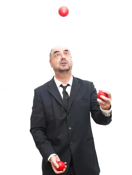 赤のボールでジャグリング、実業家 — ストック写真
