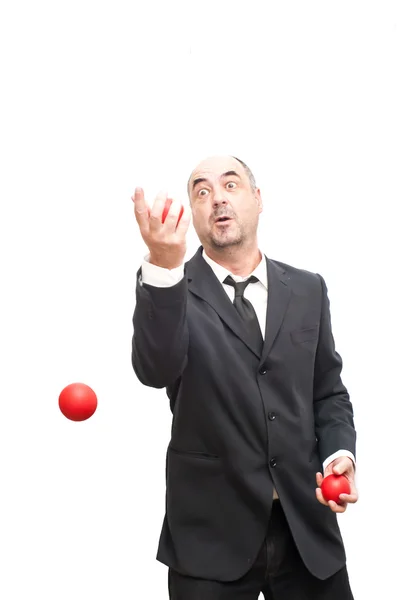 赤のボールでジャグリング、実業家 — ストック写真