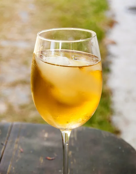 Glass of wine on a wooden table — Stock Photo, Image