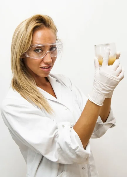 Beautiful woman doctor, with special glasses, investigating a sa — Stock Photo, Image