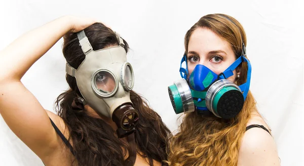 Two beautiful women with gas mask — Stock Photo, Image