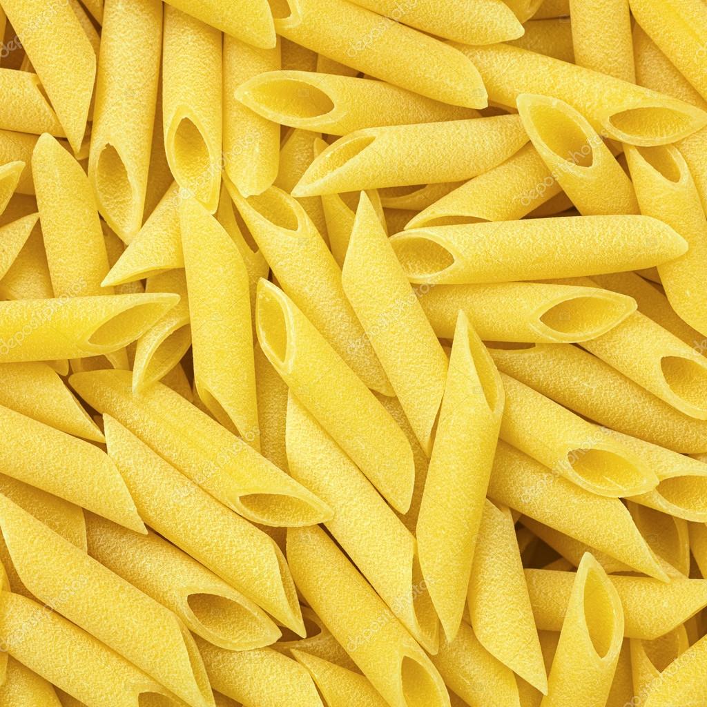 Italian Smooth Penne Lisce Macaroni Pasta raw food background or Stock