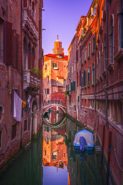 Venice cityscape, water canal, bridge and traditional buildings. Italy, Europe.