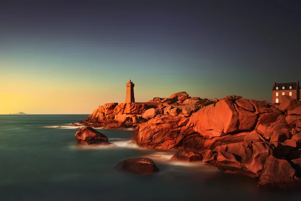 Ploumanach lighthouse sunset in pink granite coast, Brittany, Fr — Stock Photo, Image