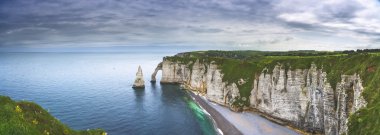 Etretat Aval cliff and rocks landmark and ocean . Normandy, Fran clipart