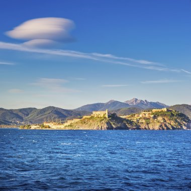 Elba island, Portoferraio village skyline and lenticular cloud. clipart