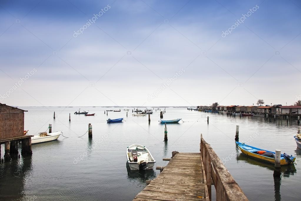 Boats and fishing huts, lagoon Comacchio valleys,  Emilia Romagn