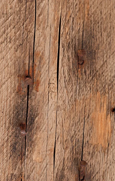 Vecchio chiodo arrugginito sul vecchio sfondo di legno — Foto Stock