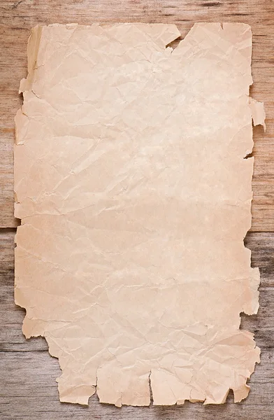 古い木製の背景に古い紙 — ストック写真