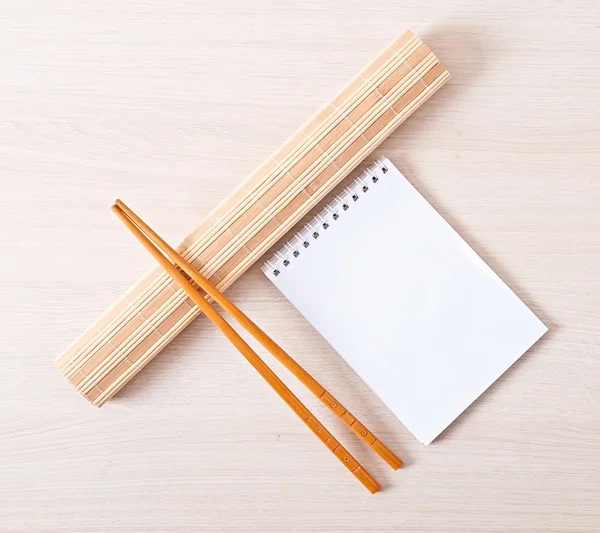 Sushi menu chopsticks for sushi on bamboo napkin — Stock Photo, Image