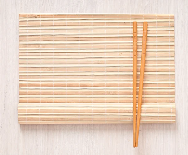 Sushi menu chopsticks for sushi on bamboo napkin — Stock Photo, Image