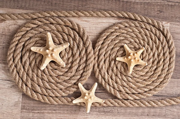 Fondo de viaje, estrellas de mar y cuerda de barco — Foto de Stock