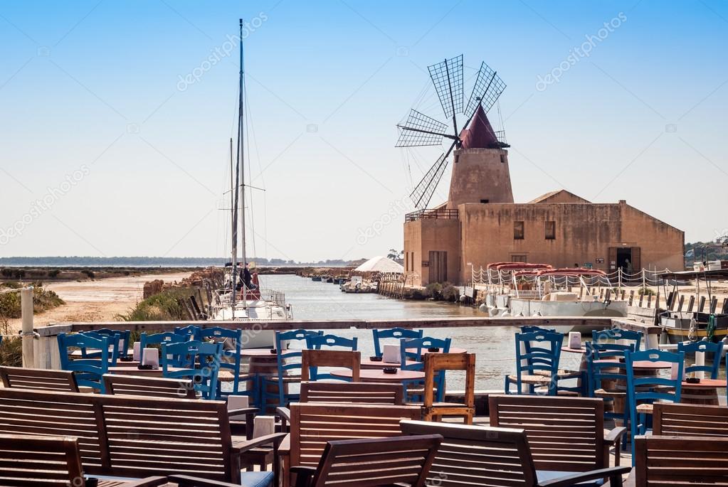 Bar with view of Mozia salt flats and an old windmill in Marsala