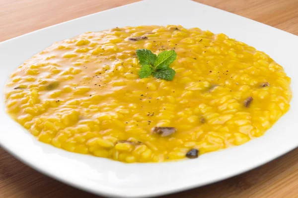Risotto with saffron and mushrooms Stock Image