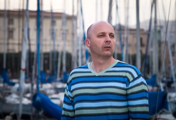 Businessman standing by expensive sailing boats and yachts in a — Stock Photo, Image