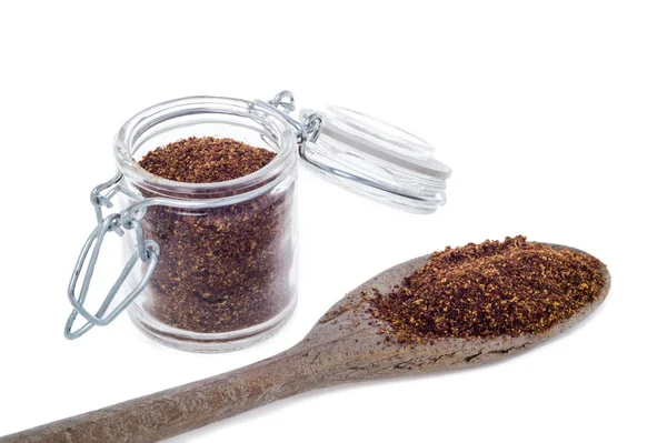 Red Chili pepper powder spices on spoon — Stock Photo, Image