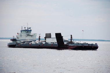 Auto ferry at Lena river Yakutia Russia clipart