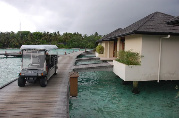 Electric service car at timber pier Maldives — Stock Photo, Image