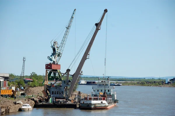 Dockside cargo crane at river port — Stock Photo, Image