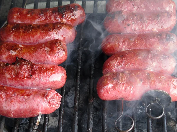 Grilled sausages on grill — Stock Photo, Image