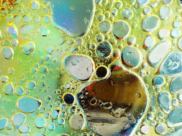 Olive oil bubbles in water close up — Stock Photo, Image