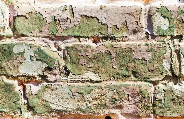 Old obsolete painted brick wall