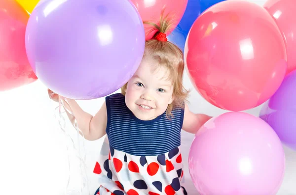 Baby girl and ballons — Stock Photo, Image