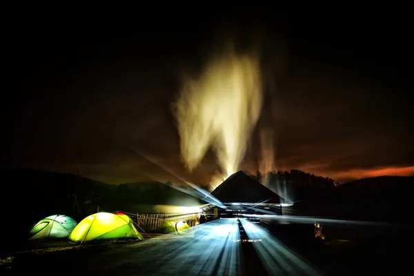 Illuminated camping tents at night — Stock Photo, Image