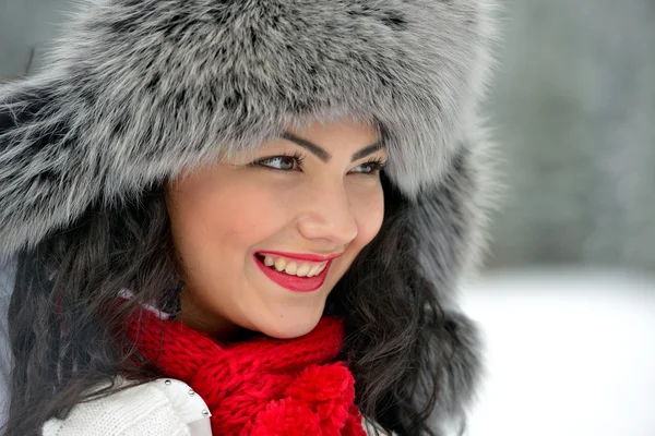 Portrait of beautiful smiling female in luxurious fur head cloth — Stock Photo, Image