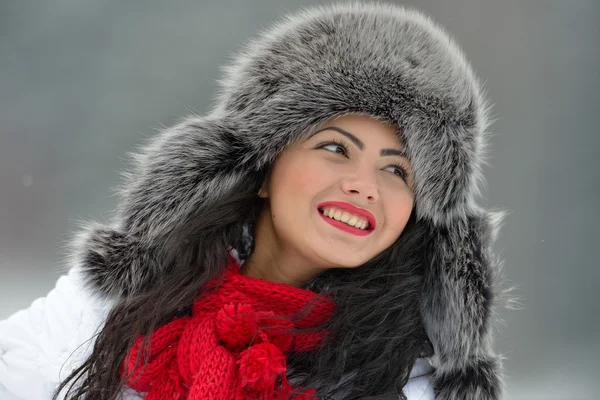 Beautiful female in luxurious fur head cloth outdoor in winter — Stock Photo, Image