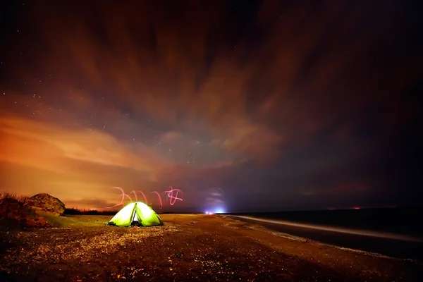 Touristic tent on the beach by night — Stock Photo, Image