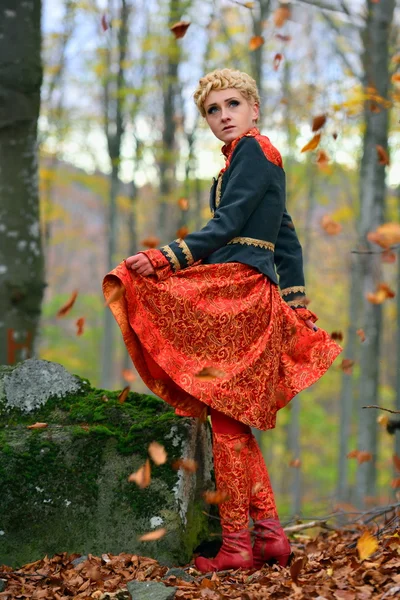 Beautiful elegant woman in autumn forest — Stock Photo, Image
