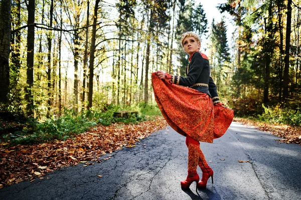 Beautiful elegant blonde woman in autumn forest — Stock Photo, Image