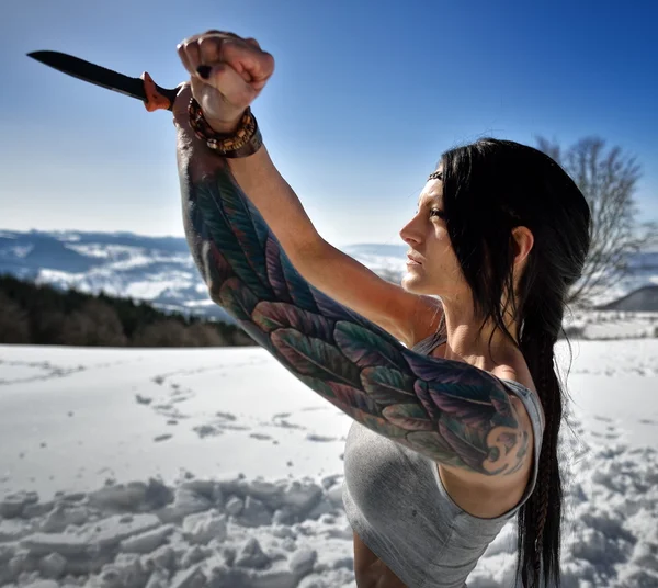 Portrait of young athletic woman holding  knife — Stock Photo, Image