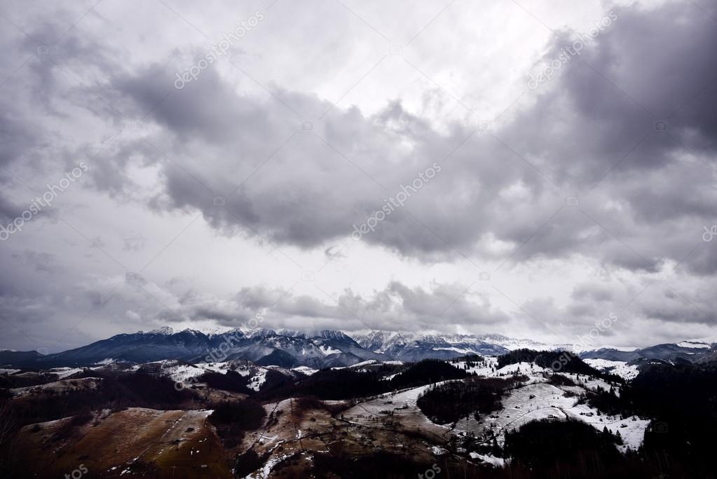 mountain landscape in winter with cloudy sky