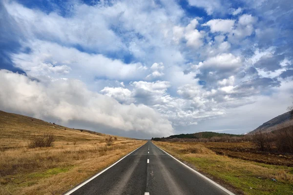 Empty road on field — Stock Photo, Image