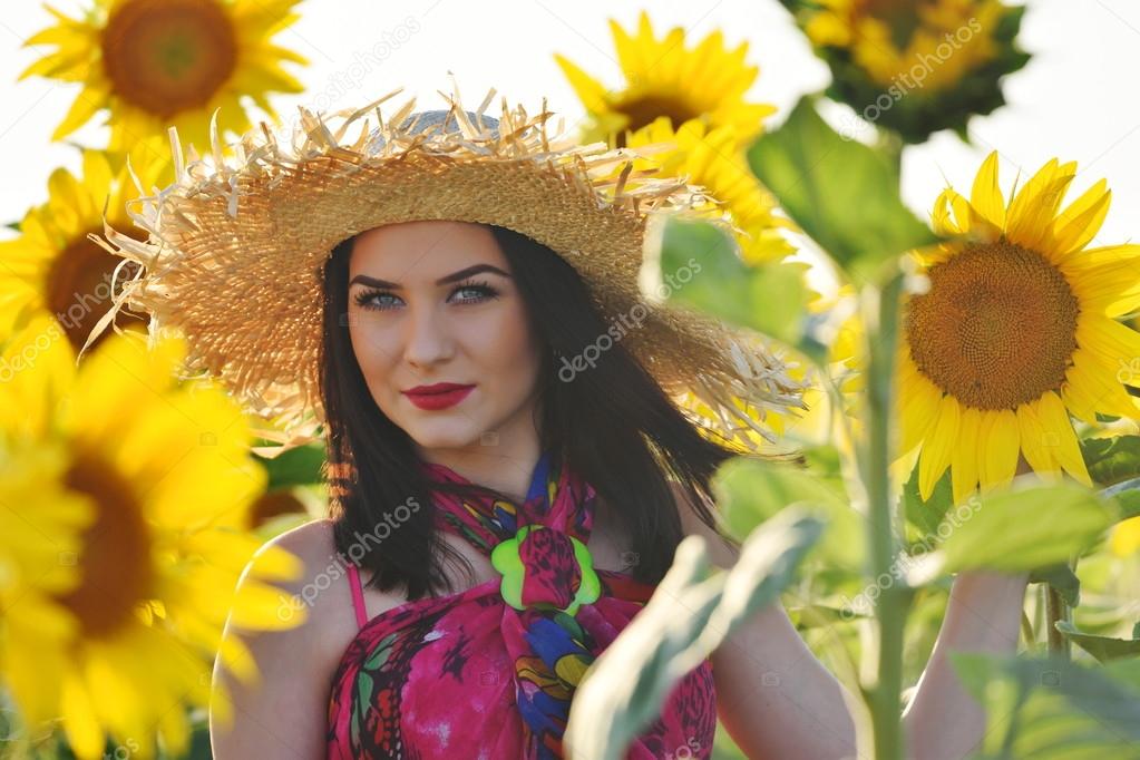 https://st2.depositphotos.com/1422604/9642/i/950/depositphotos_96425434-stock-photo-young-pretty-woman-at-sunflower.jpg