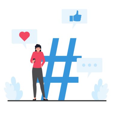 Ayakta duran ve telefonlarını büyük bir etiketin yanında tutan kadınlar.