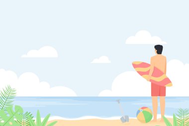 Adam sahilde sörf tahtası tutuyor.