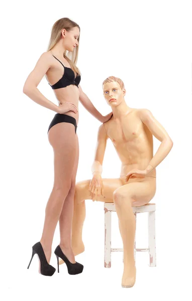 Girl standing next to a mannequin — Stock Photo, Image