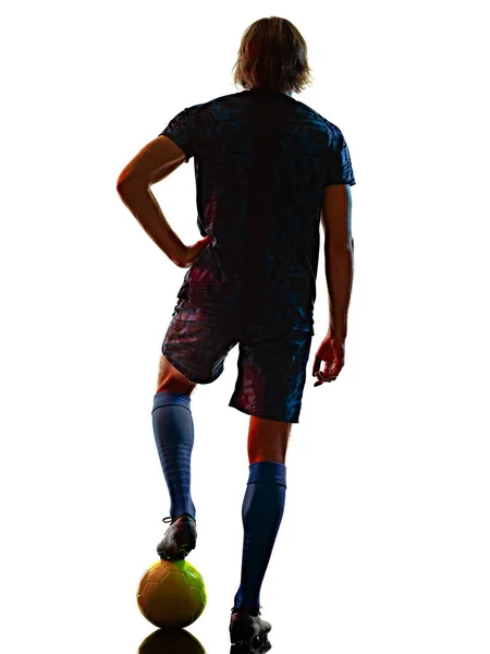 Ung fotbollsspelare isolerad vit bakgrund siluett skugga Stockfoto