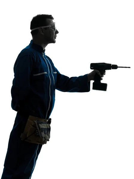 Homem trabalhador da construção segurando silhueta broca — Fotografia de Stock