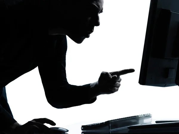 Een business man silhouet computing computer boos ontevreden — Stockfoto