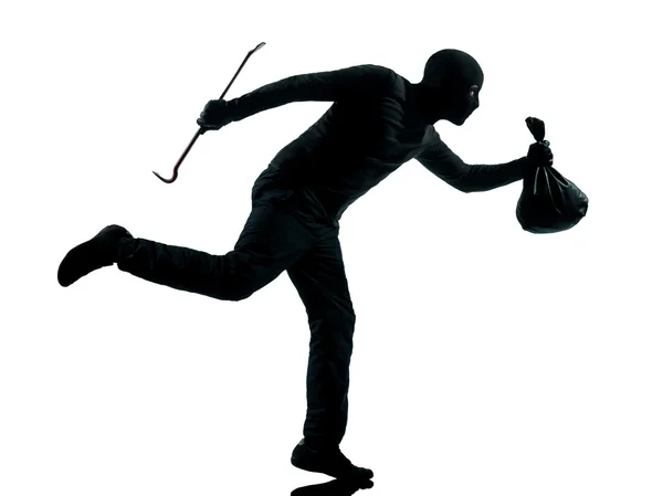 Człowiek złodziej karnego sylwetka działa — Zdjęcie stockowe