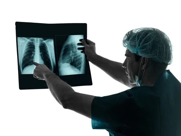 Doctor surgeon radiologist examining lung torso x-ray image silh — Stock Photo, Image