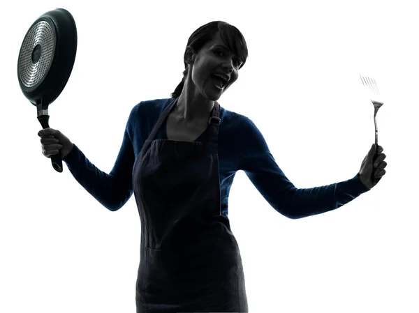 Woman happy cooking holding frying pan silhouette — Stock Photo, Image